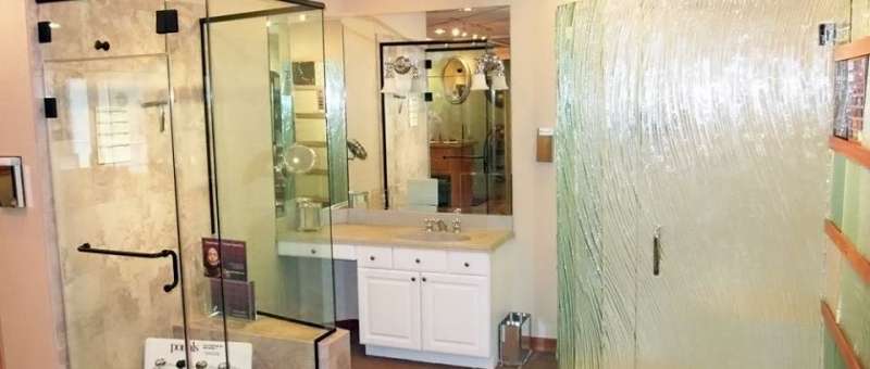 Display of 2 standing showers and bathroom vanity