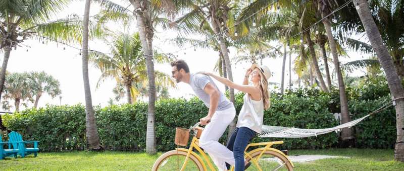 Man and Woman on a yellow bicycle