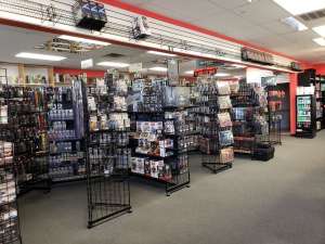 Racks filled with video games and collector memorabilia