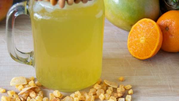 Mason jar filled with yellow tea