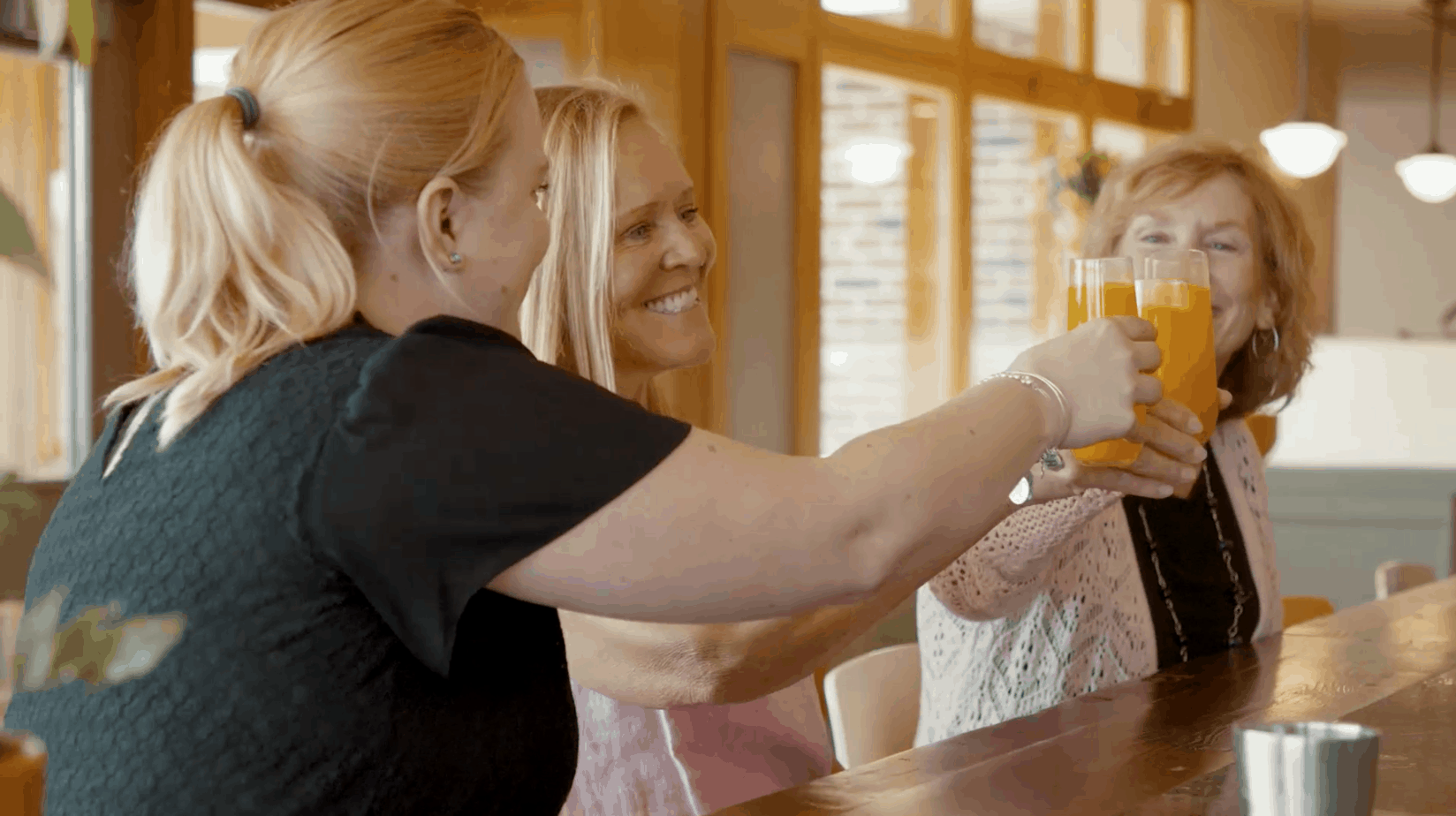 3 Women drinking mimosas at Mimosa Breakfast