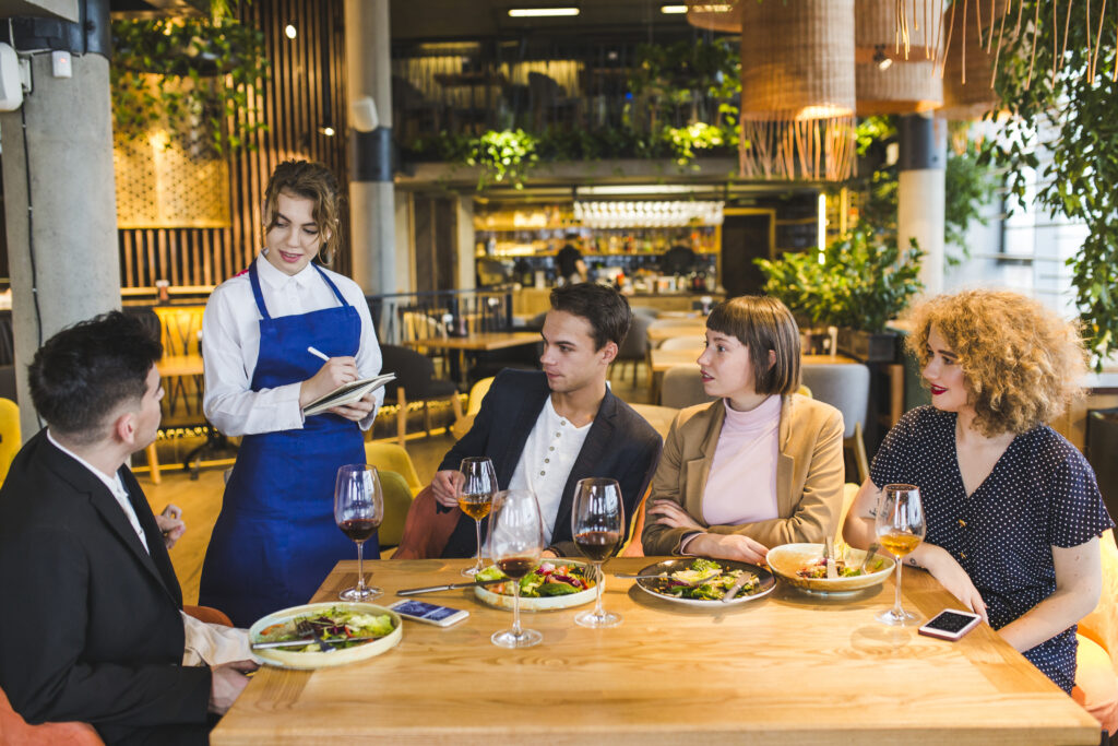 group-friends-eating-restaurant